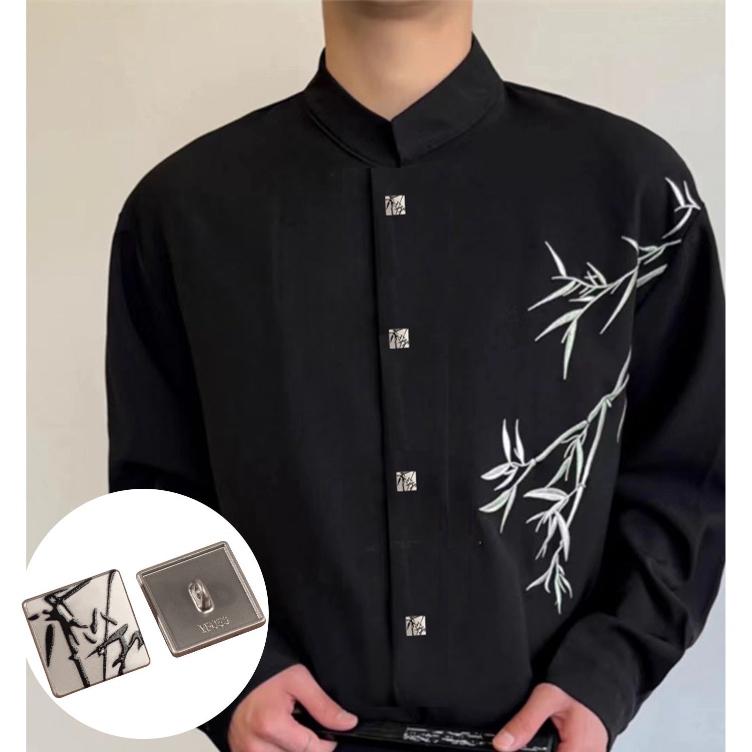 Black shirt front with square button inset; white face with black ink motif