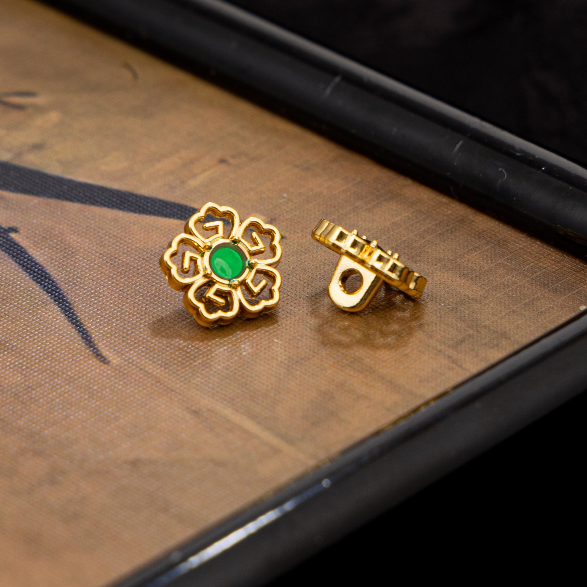 Gold-tone floral Chinese cufflinks with green stone and clasp back