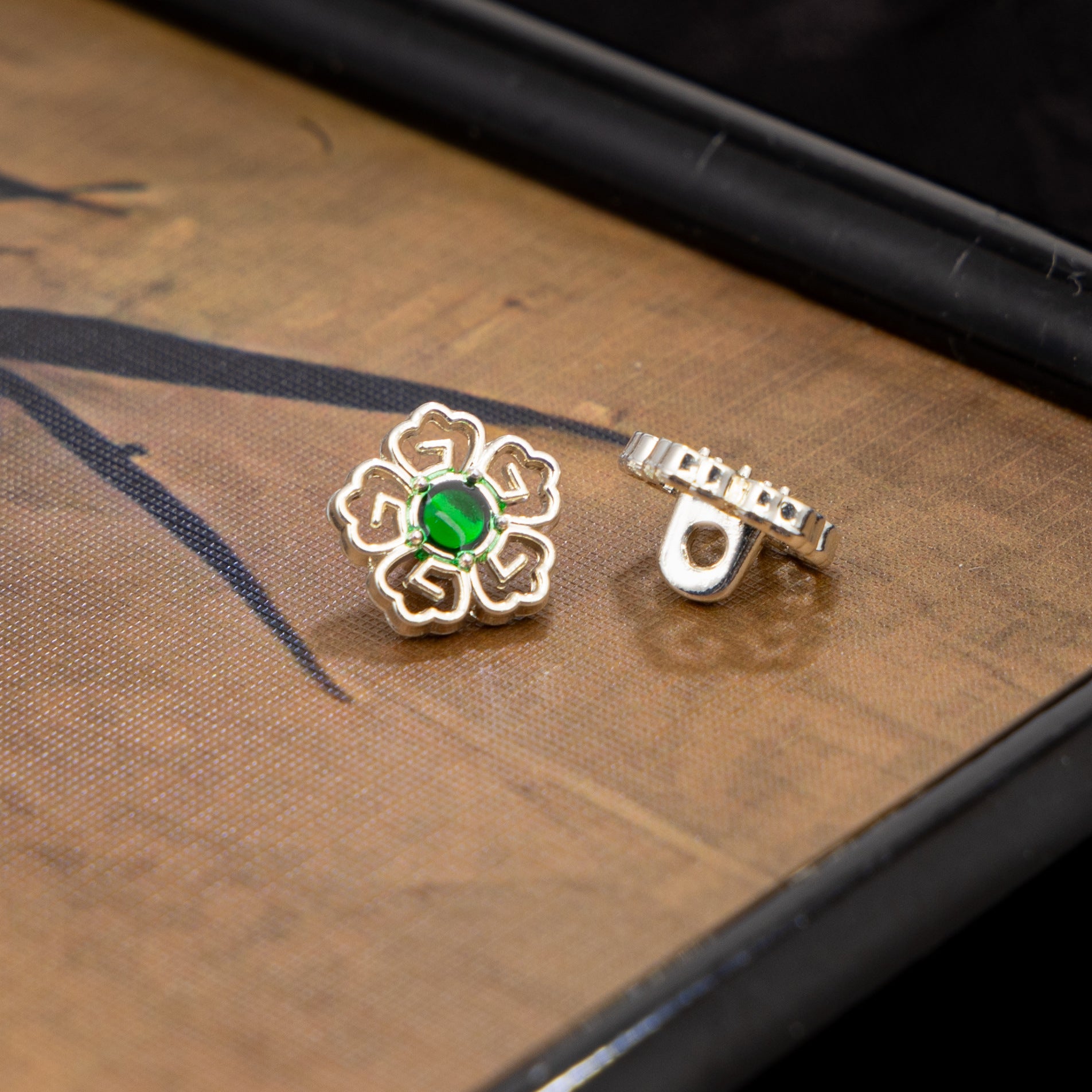 Silver-tone floral Chinese cufflinks with green stone and clasp back
