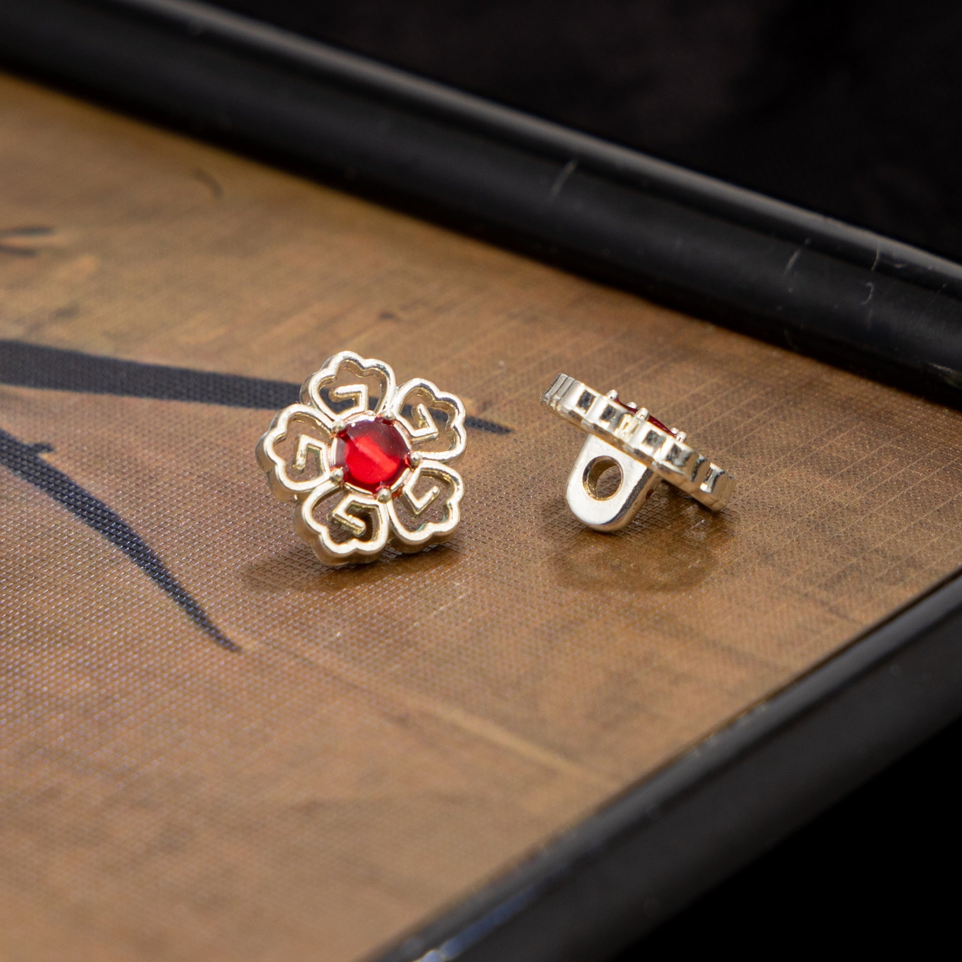Silver-tone floral Chinese cufflinks with red stone and clasp back