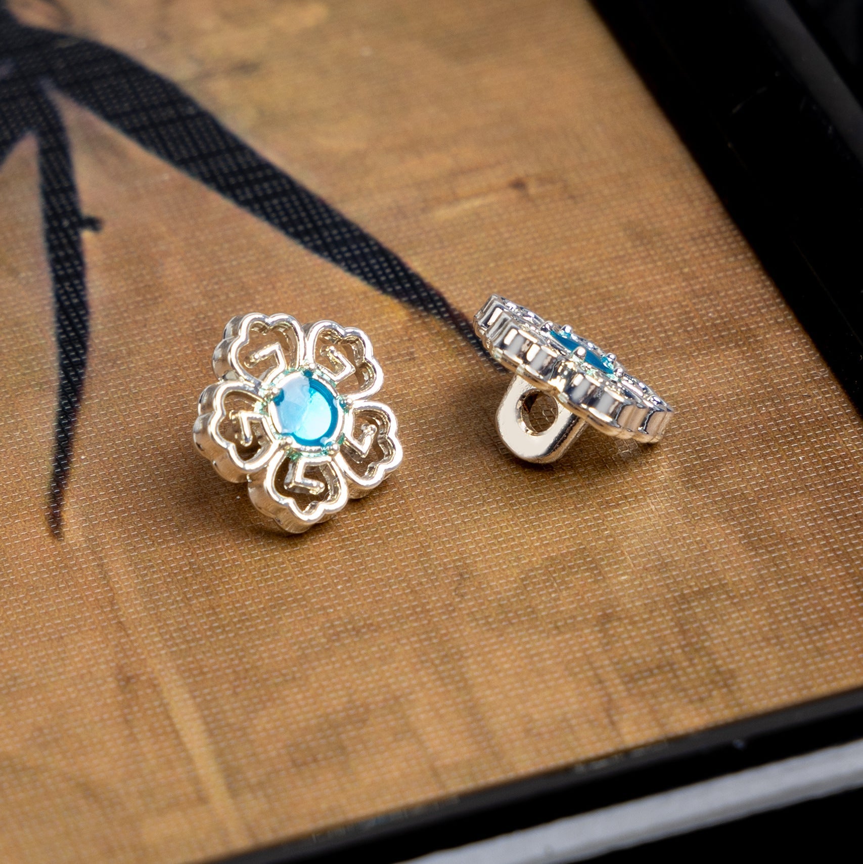 Silver-tone floral Chinese cufflinks with blue stone and clasp back