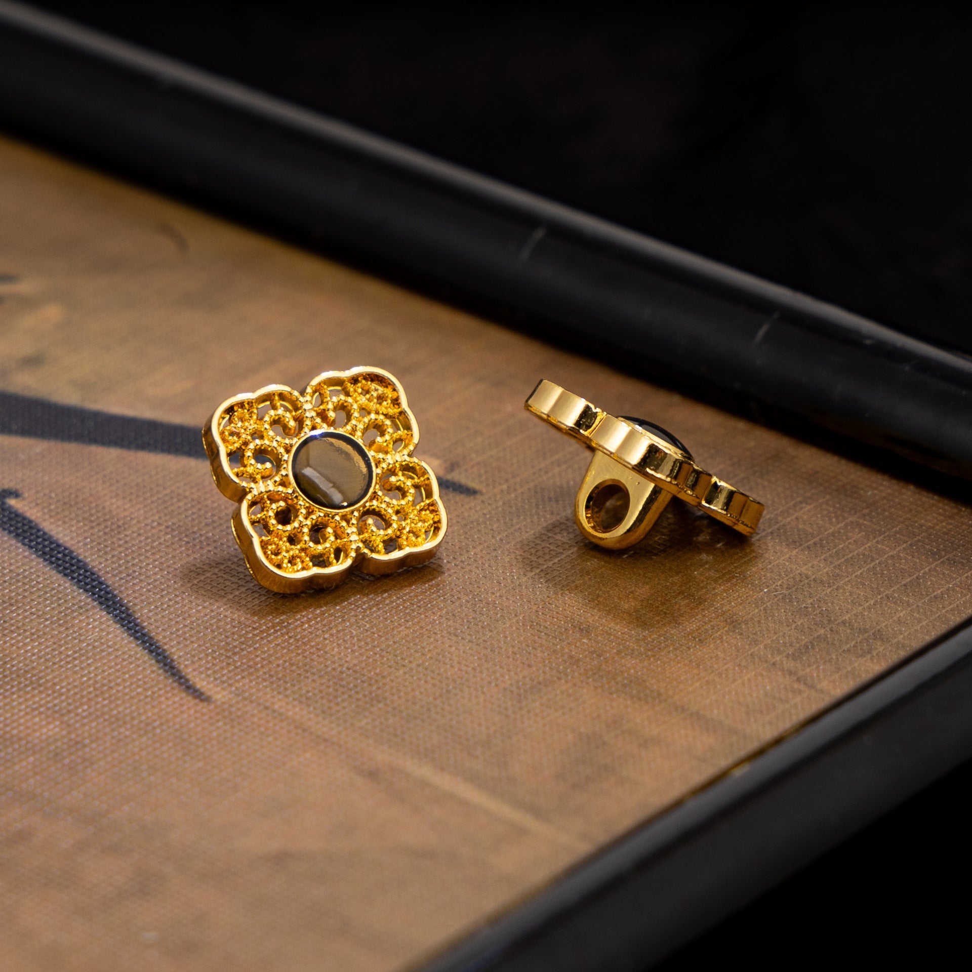 Gold square button backs with round holes, Chinese-style filigree (front not shown)
