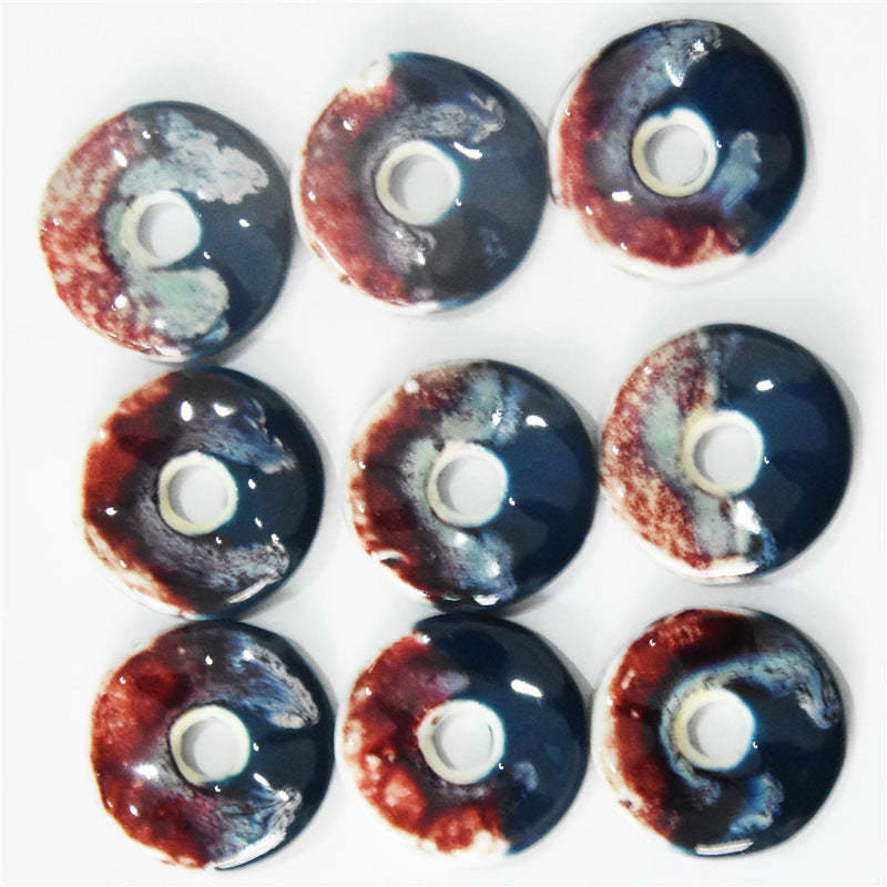 40mm ceramic pendant buttons, contrasting red top with dark blue base, round with center hole.