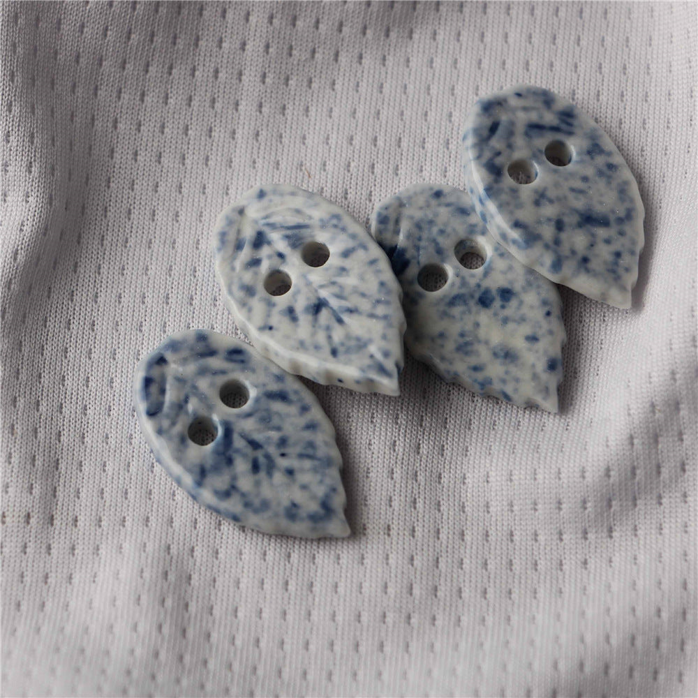 Blue and white ceramic leaf-shaped 2-hole sewing buttons, speckled, 10pcs
