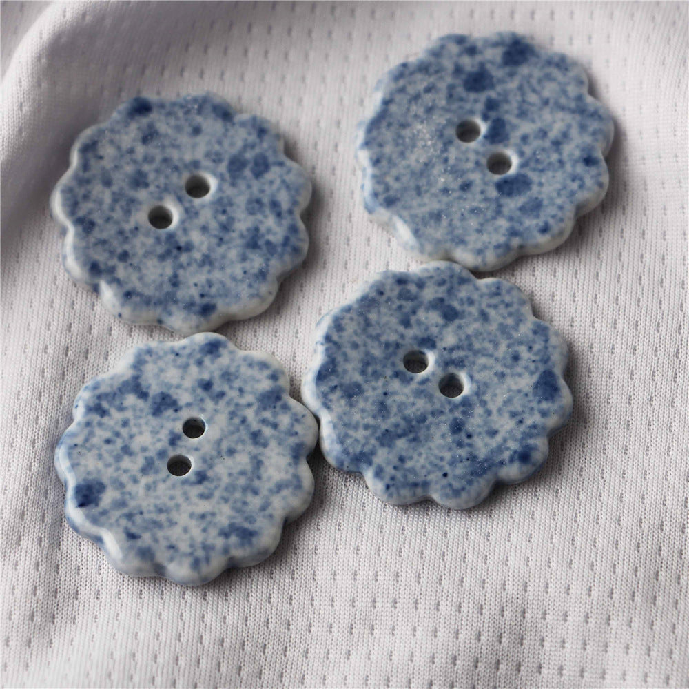 Blue and white ceramic clover-shaped 2-hole sewing buttons, speckled, 10pcs