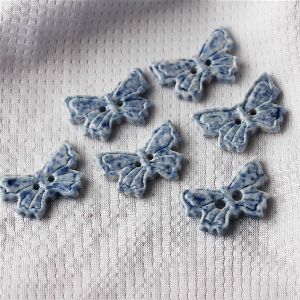 Blue and white ceramic butterfly-shaped 2-hole sewing buttons, speckled, 10pcs