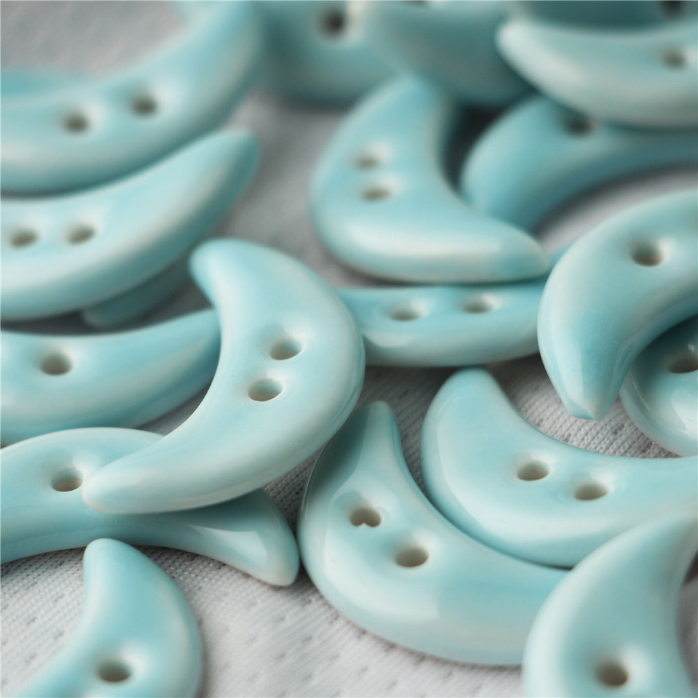 28mm crescent ceramic buttons with two holes, light blue for bag decoration