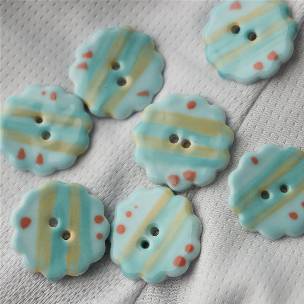 Light blue ceramic buttons with yellow stripes and red dots, two holes (6-pack)