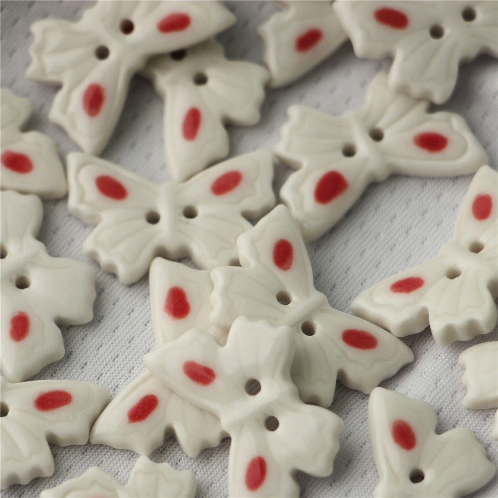 White ceramic butterfly buttons, 2-hole, red oval accents