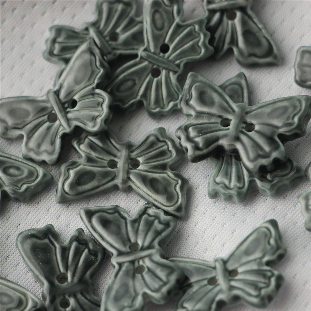 Dark gray ceramic butterfly buttons, 2-hole, molded butterfly shape