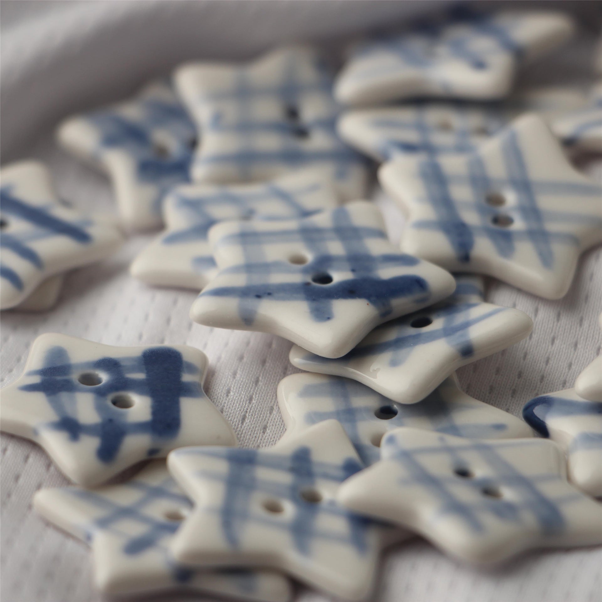 Star-shaped ceramic sewing buttons in white with blue print, two-hole design (4PCS)