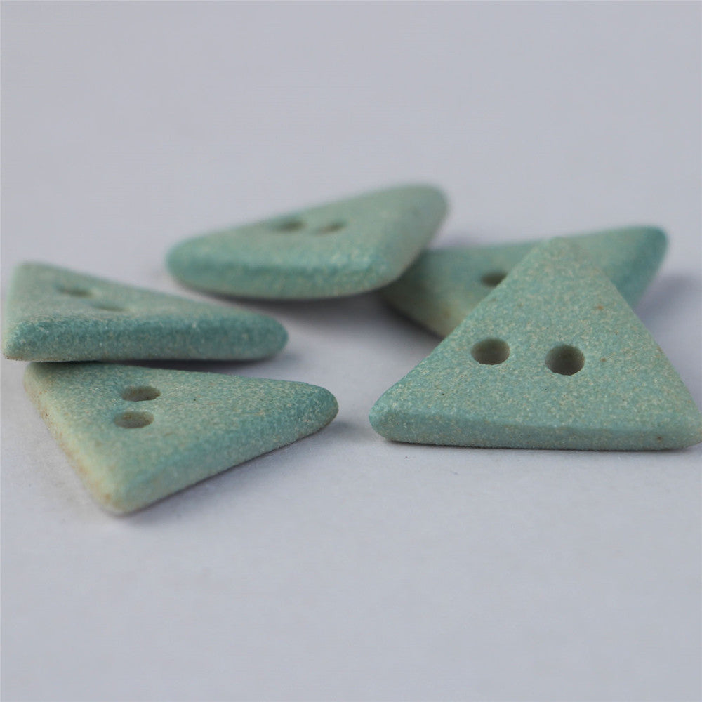 Matte light blue ceramic triangular buttons, 2-hole, scattered