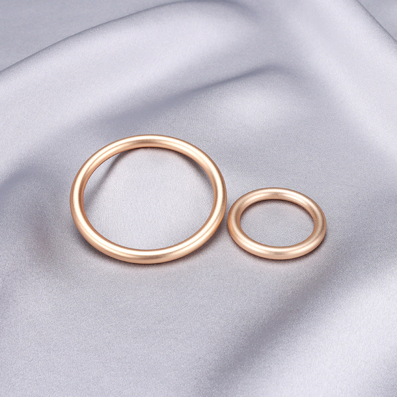 Zwei goldfarbene Metallringe für Gurtband, 20–45 mm