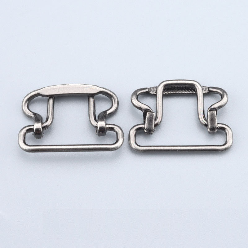 Two silver-toned 28mm buckle clasps; right has raised rectangular top detail