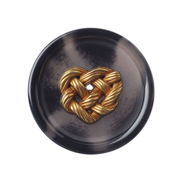 Round dark resin button with gold woven heart metal design, front view