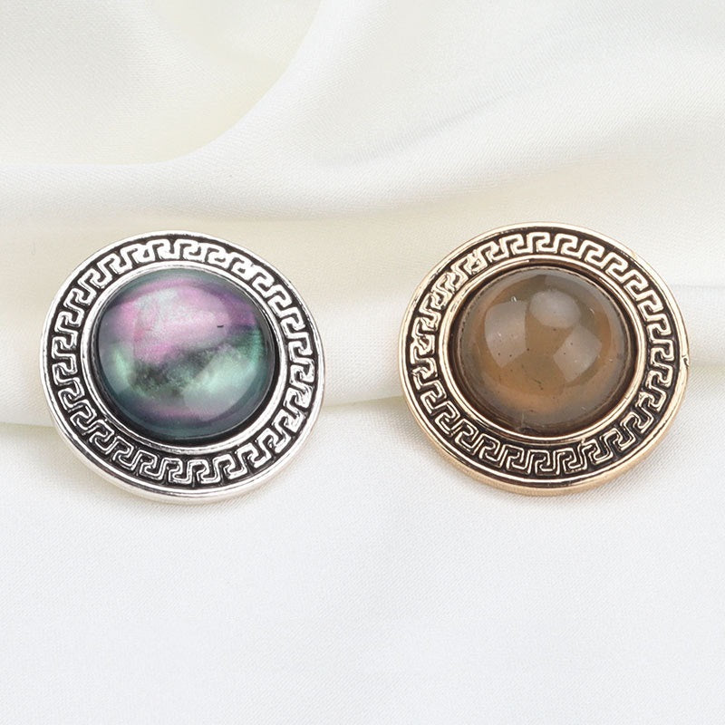 Pair of round geometric resin metal shank buttons, silver and gold, 22mm