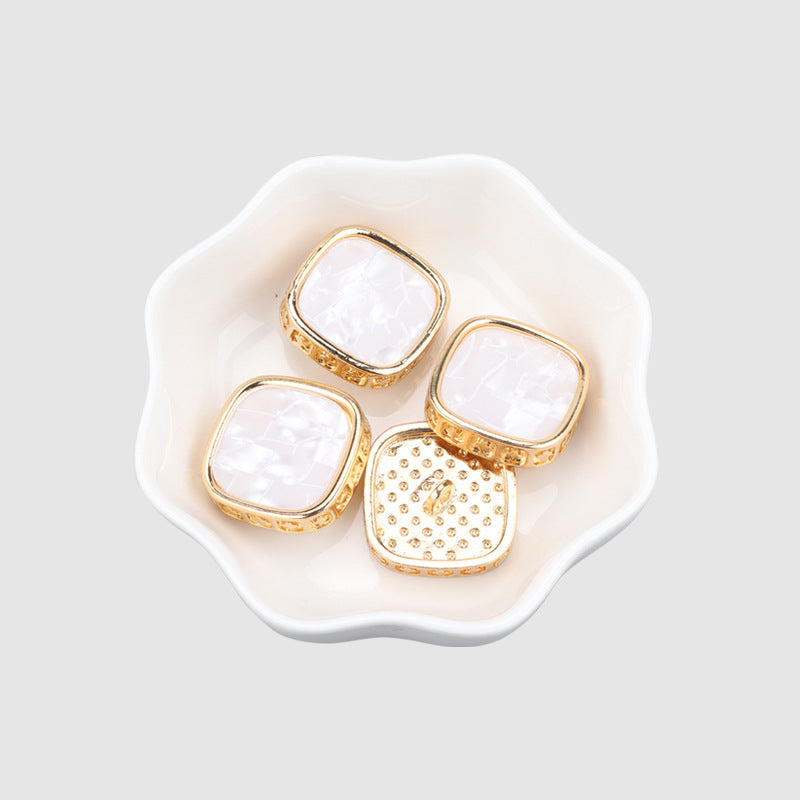 Gold square metal shank coat buttons, pearl-like faces, multiple pieces
