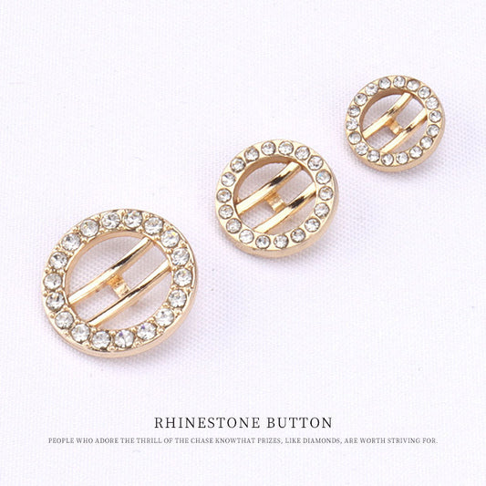 Three rose gold rhinestone buttons with oval cutout and bar accents