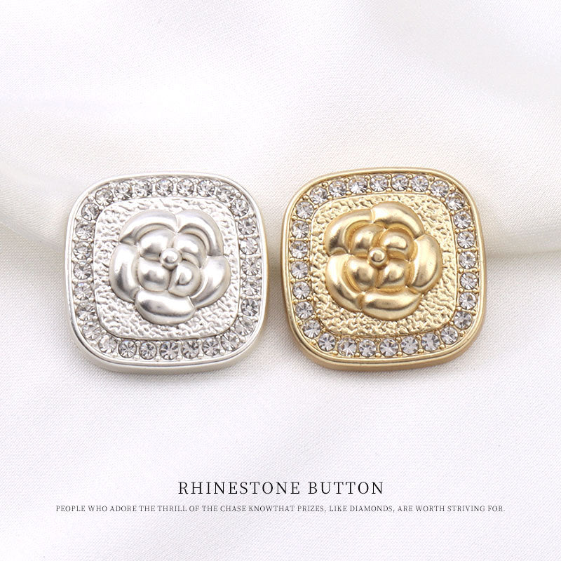 Two square rhinestone buttons: silver and gold, embossed floral motif