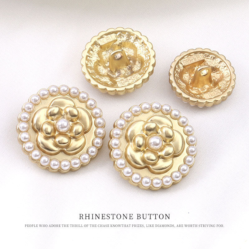 Round golden metal flower pearl buttons, visible backs and central shank detail