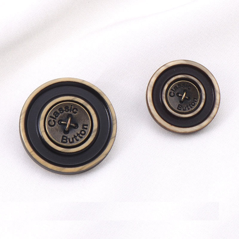 Pair of bronze resin metal shank buttons with black center and metal loop shanks