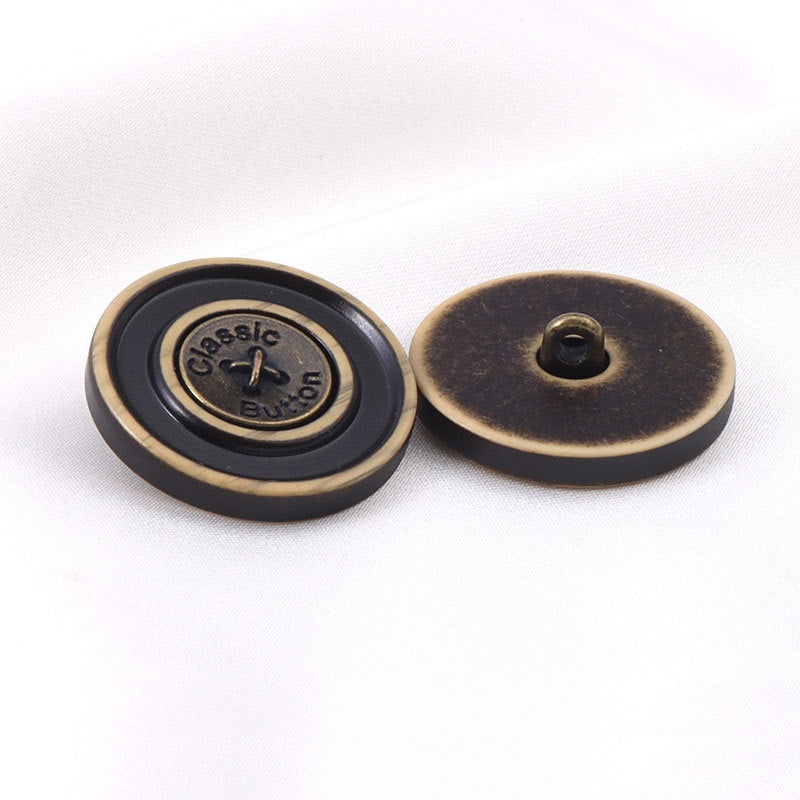 Front and back view: bronze round resin button with black center and shank hole