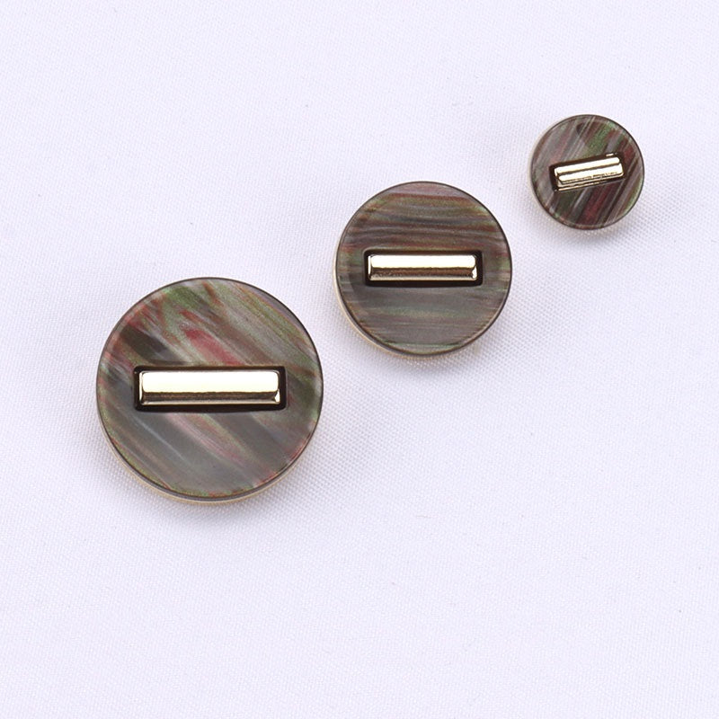 Round resin shank buttons in dark brown, gray, and small round sizes with gold frames