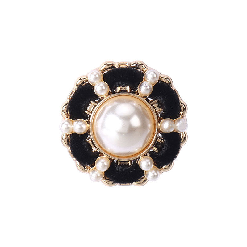Black velvet shank button with gold rim, faux pearl center and pearl border.
