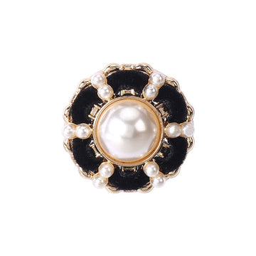 Black velvet shank button with gold rim, faux pearl center and pearl border.