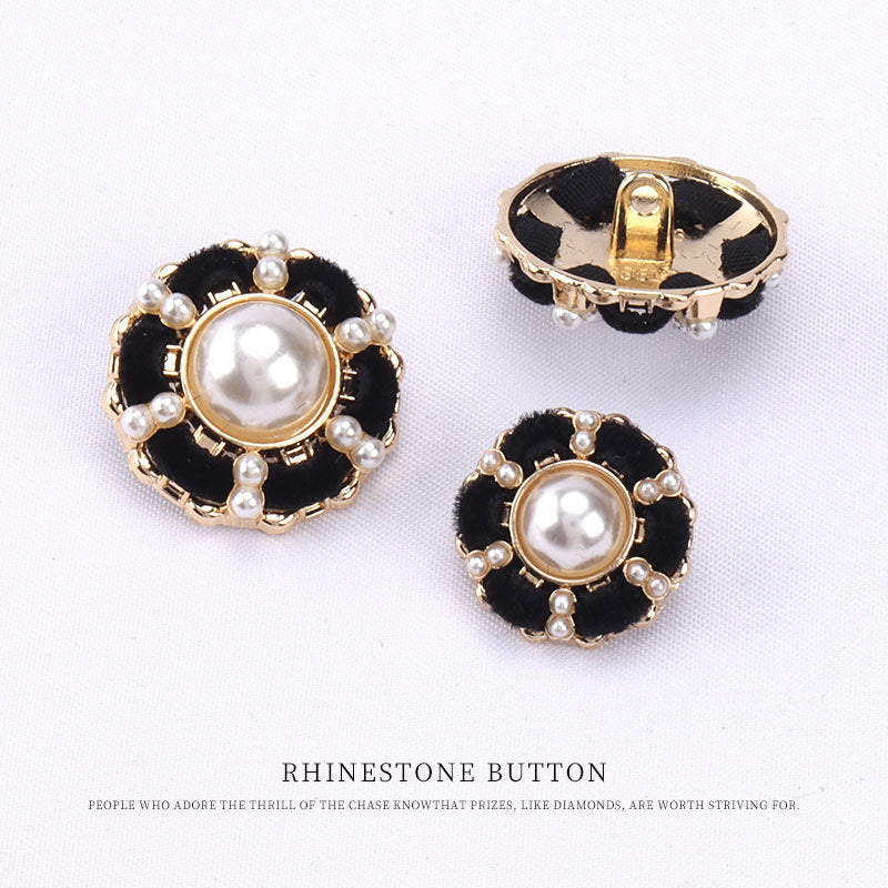 Gold-edged black velvet button with pearl beading and loop shank back.