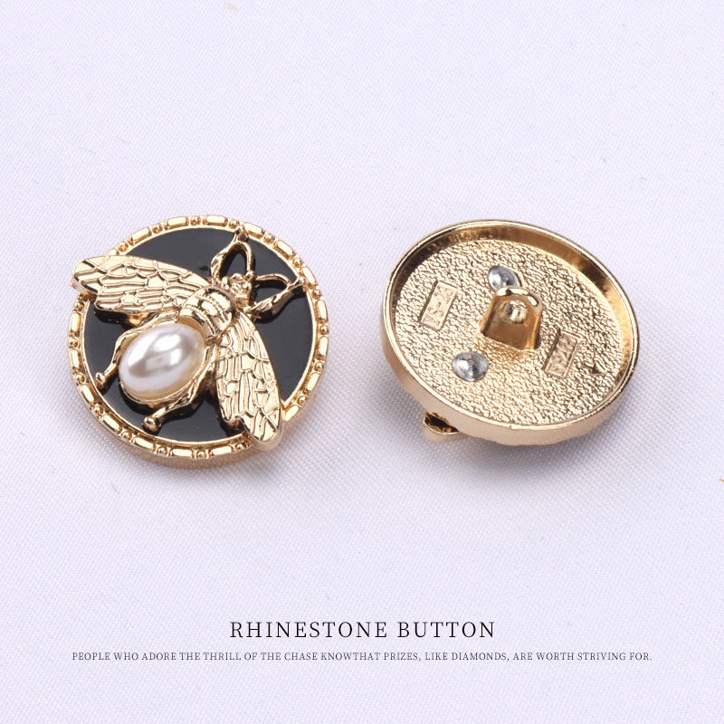 Bee metal pearl shank button, gold-toned back with two attachment holes/prongs