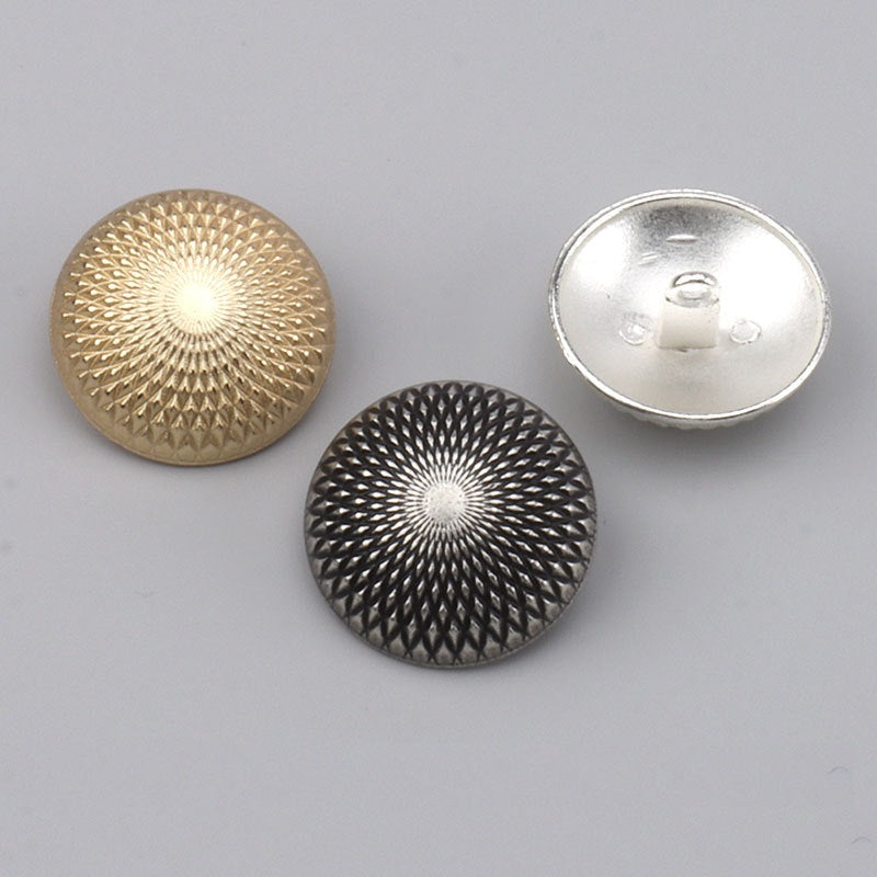 Assorted buttons: gold and dark-silver fronts with one silver back side visible