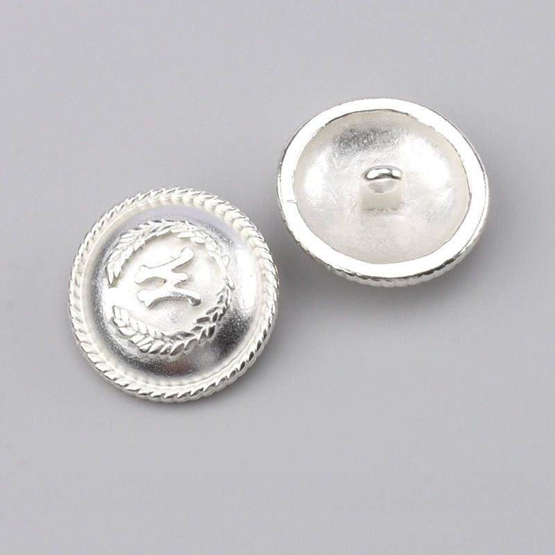 Silver metal button front with leaf wreath and matching back with shank