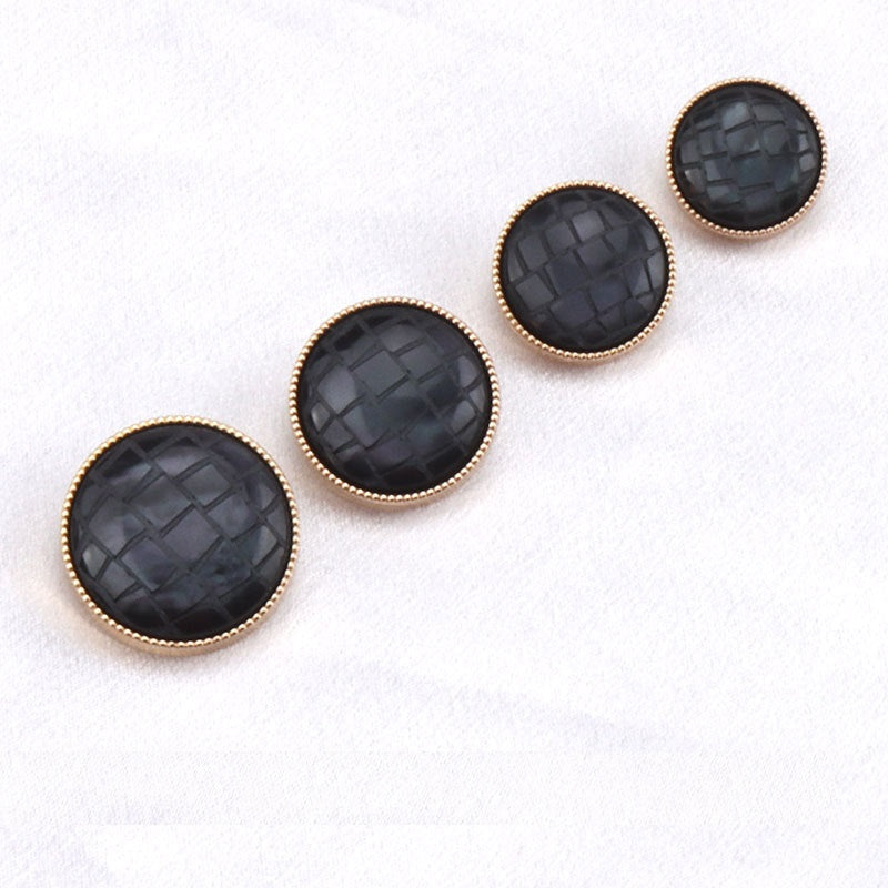Round black check pattern resin shank buttons with gold-tone rims