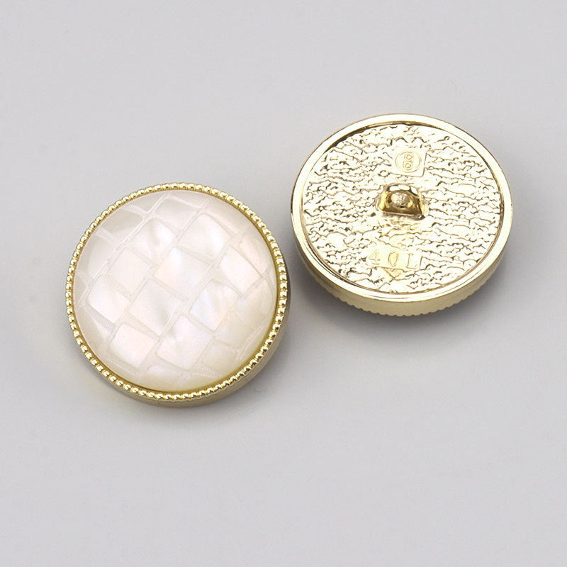White check resin shank button front with gold-tone backside
