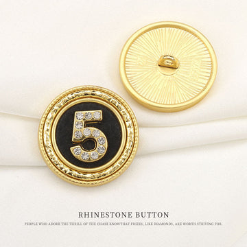 Round gold rhinestone button, number 5 design on black center, shank back