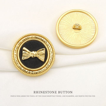 Set of 6 gold metal shank buttons with bow-knot design on dark center