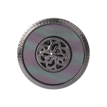 Gunmetal resin metal button with engraved floral emblem and ridged border, front view