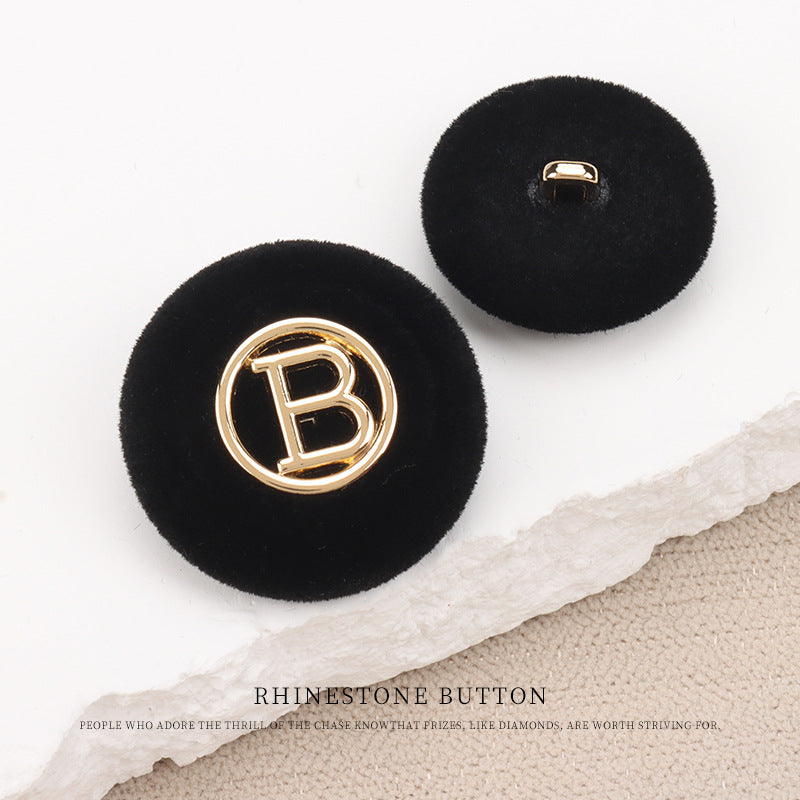 Black flocked round “B” buttons with shank: gold “B” front, back shows mounting hole