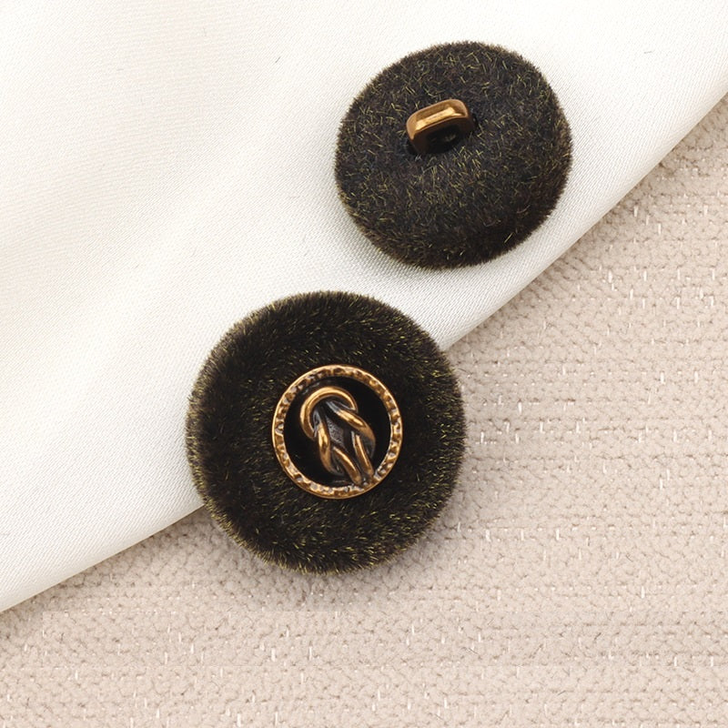 Brown flocked metal combination button with gold shank and logo, front and back