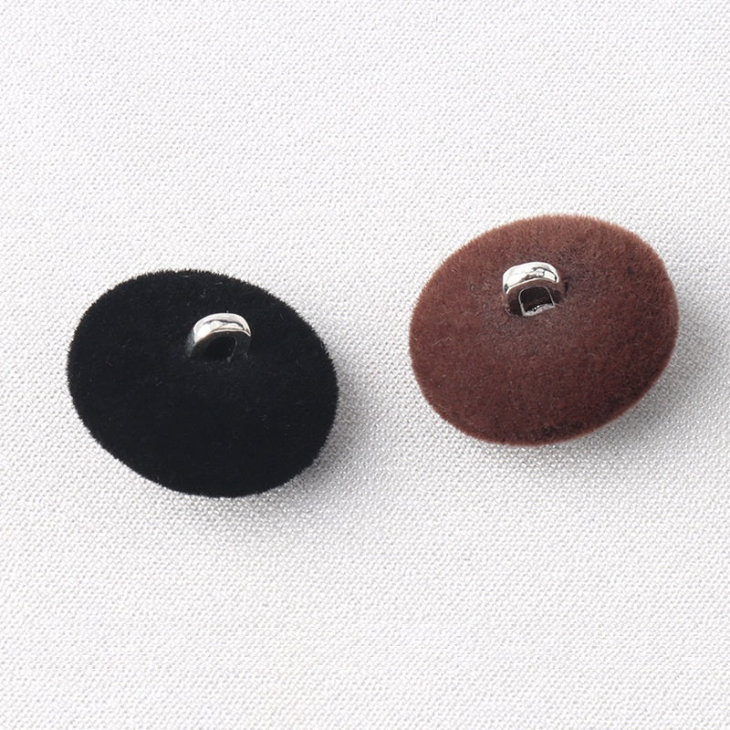 Back view: black and brown flocked diamond shank buttons with metal loops