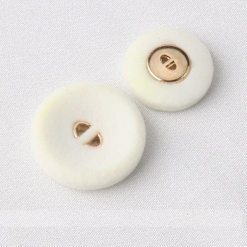 White round flocked coat buttons, two-hole design with gold-tone loops