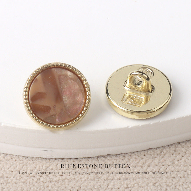 Brown resin-look 11mm button with gold rim and gold metal back