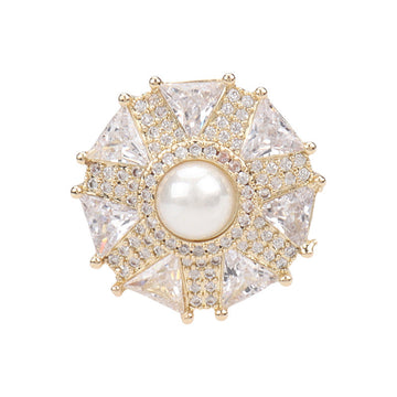 Umbrella-shaped coat button with goldtone rim, round pearl center, and crystal rhinestones