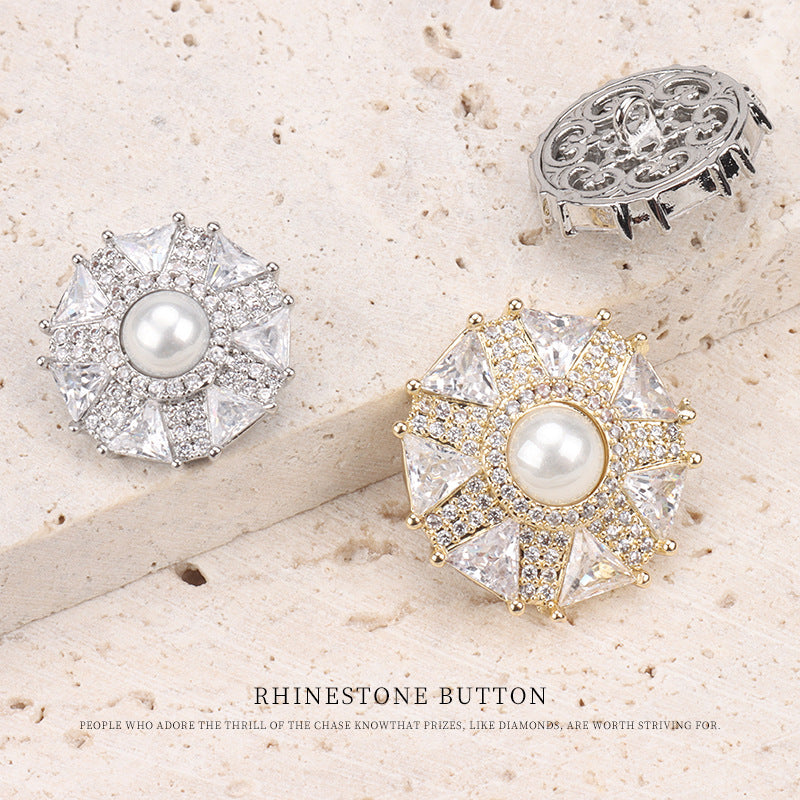 Umbrella-shaped coat button pair with pearl centers; one silver-tone, one goldtone, clip back
