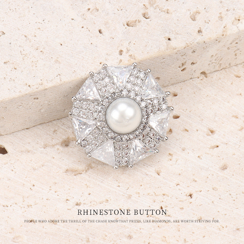 Silver-tone umbrella coat button with round pearl center and prong-set crystal rhinestones