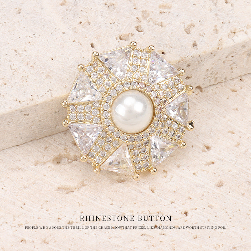 Goldtone umbrella coat button with round pearl center and prong-set crystal rhinestones