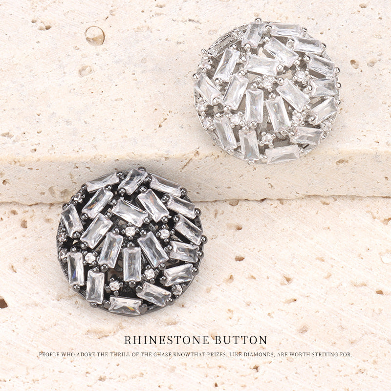 Pair of rhinestone buttons with clear baguette stones and metal prongs