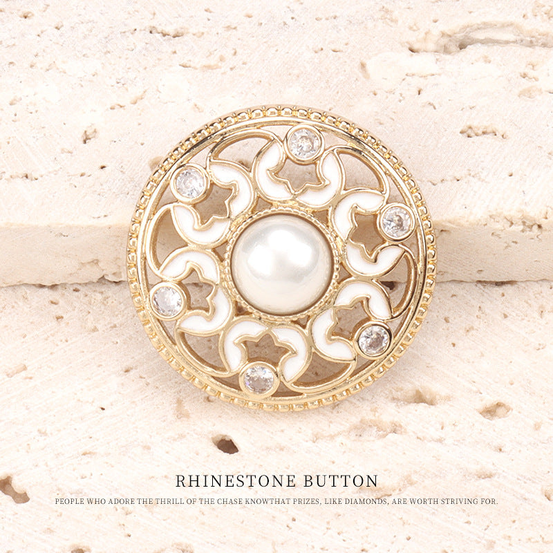 Dotted oil-pearl rhinestone button: gold tone, white enamel filigree, pearl center