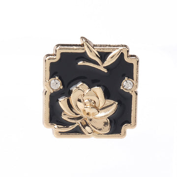 Square metal shank button, black enamel with gold lotus and small crystal accents